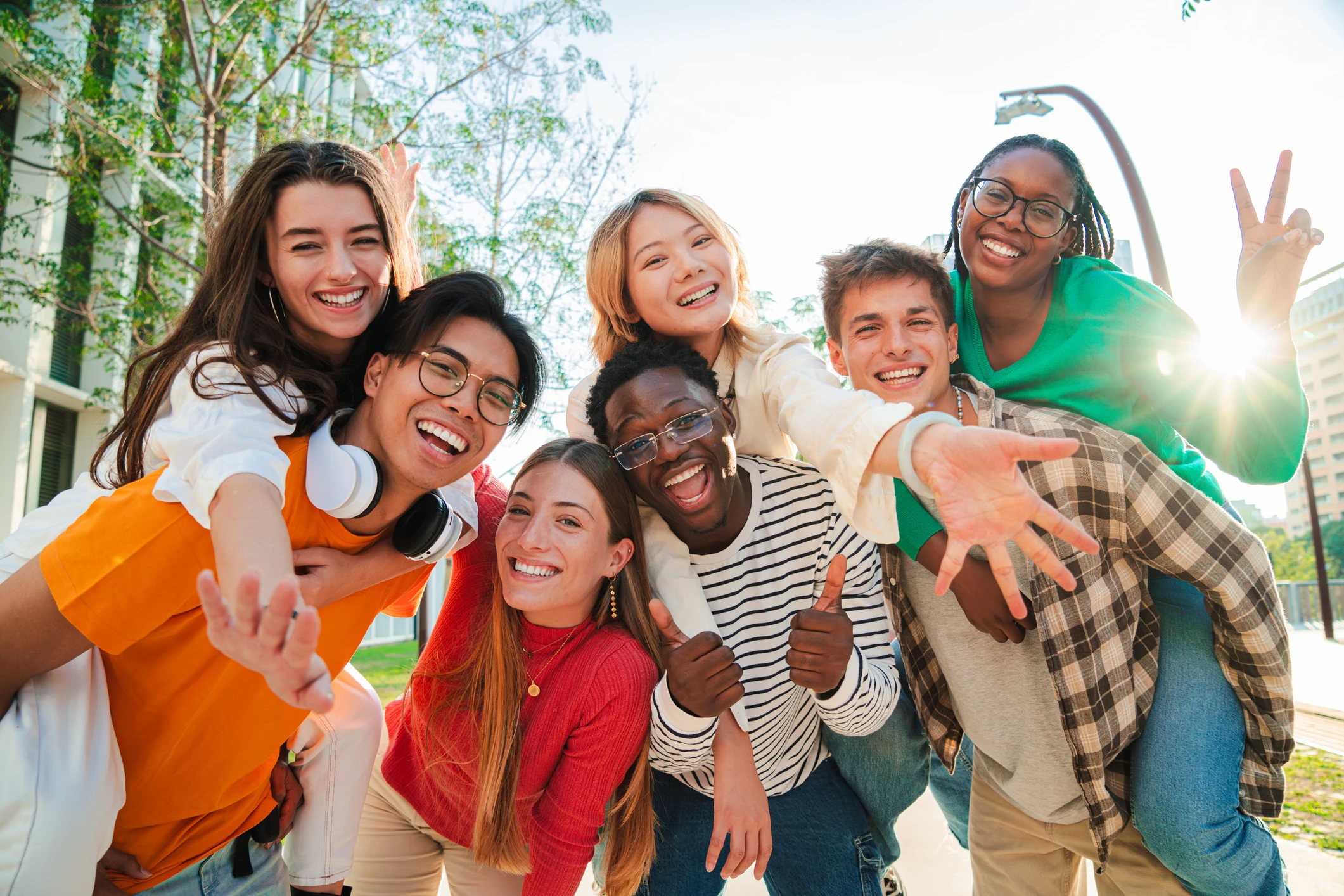 Big group of multiracial young student people smiling, gesturing and looking at camera. (1) - Maryvale