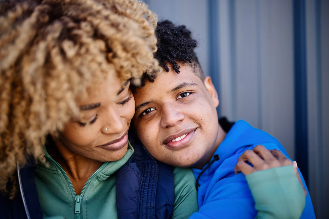 Parent embracing their child - Maryvale