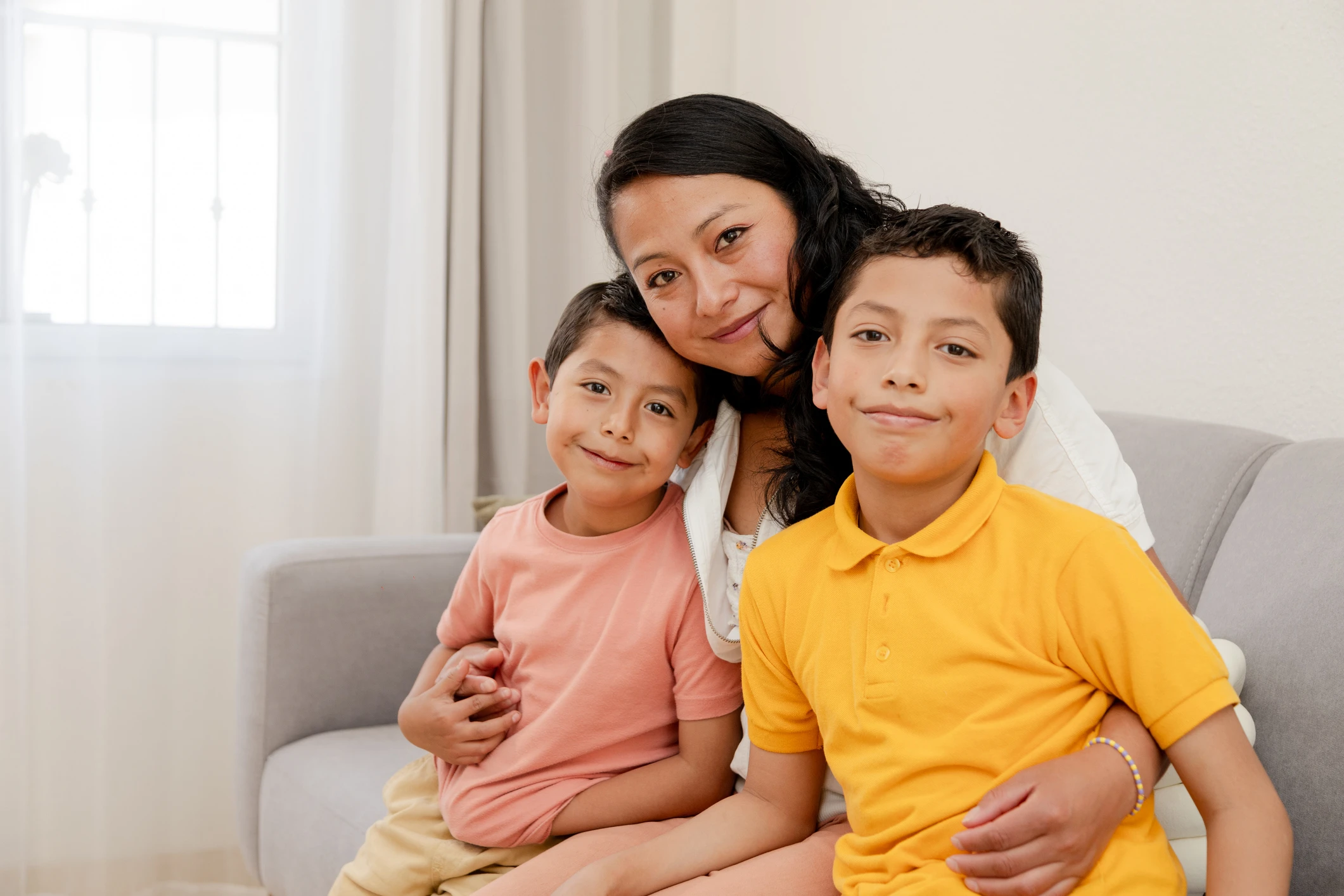 single mother with her children-happy little family-Hispanic family - Maryvale